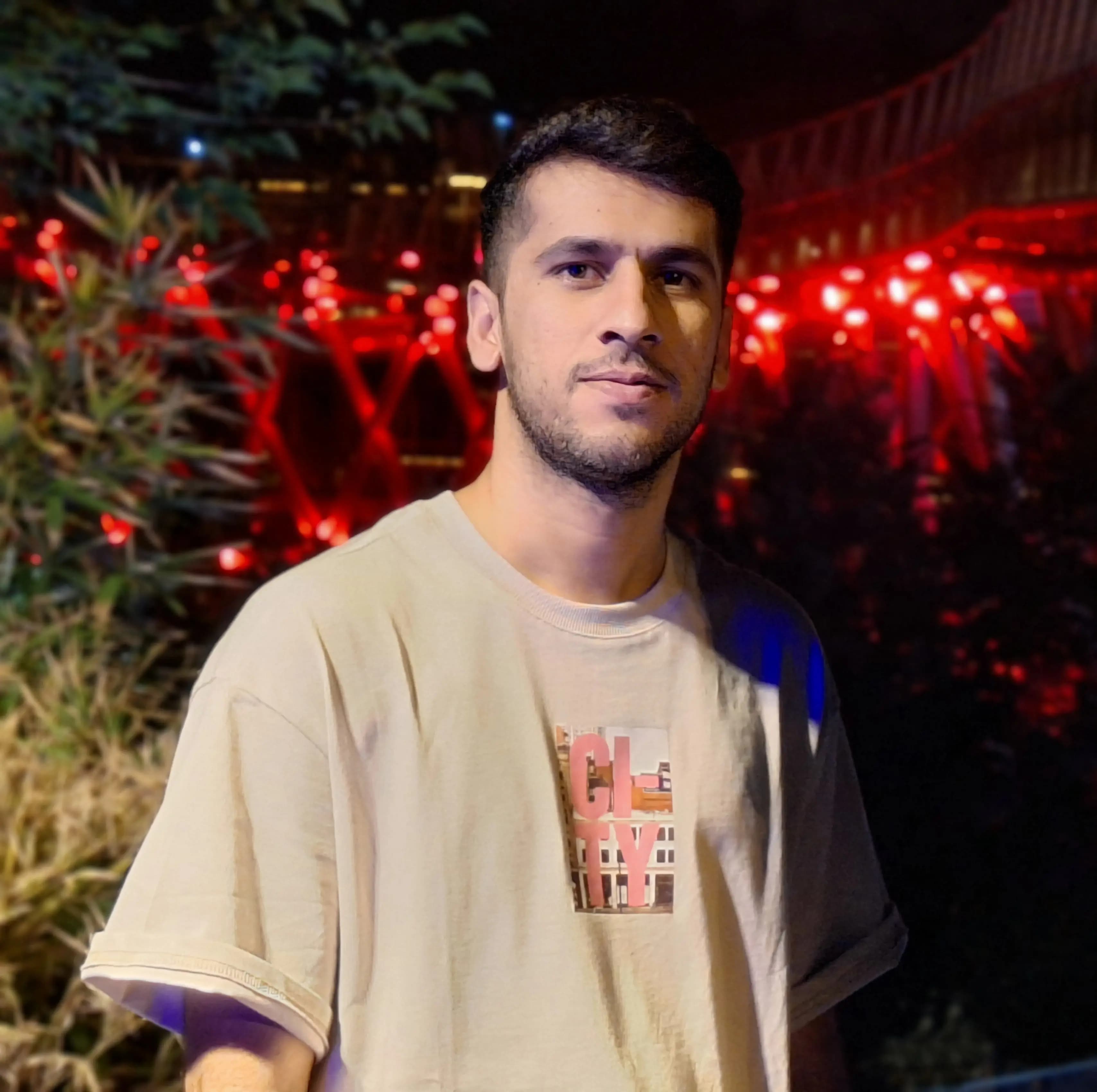 An image of Hosein Pouyanmehr with the background of Tabiat Bridge in Tehran, Iran